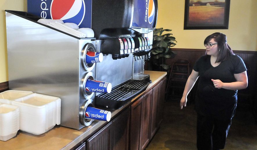 FOR RELEASE SATURDAY, FEBRUARY 4, 2017, AT 12:01 A.M. MST. - Nimsi Santacruz prepares the drink station for the lunch crowd Jan. 18 at Upper Crust Bistro and Grill, one of the businesses in the Burley-Heyburn Industrial Park occupying the former Simplot factory site.  (Laurie Welch/The Times-News via AP)
