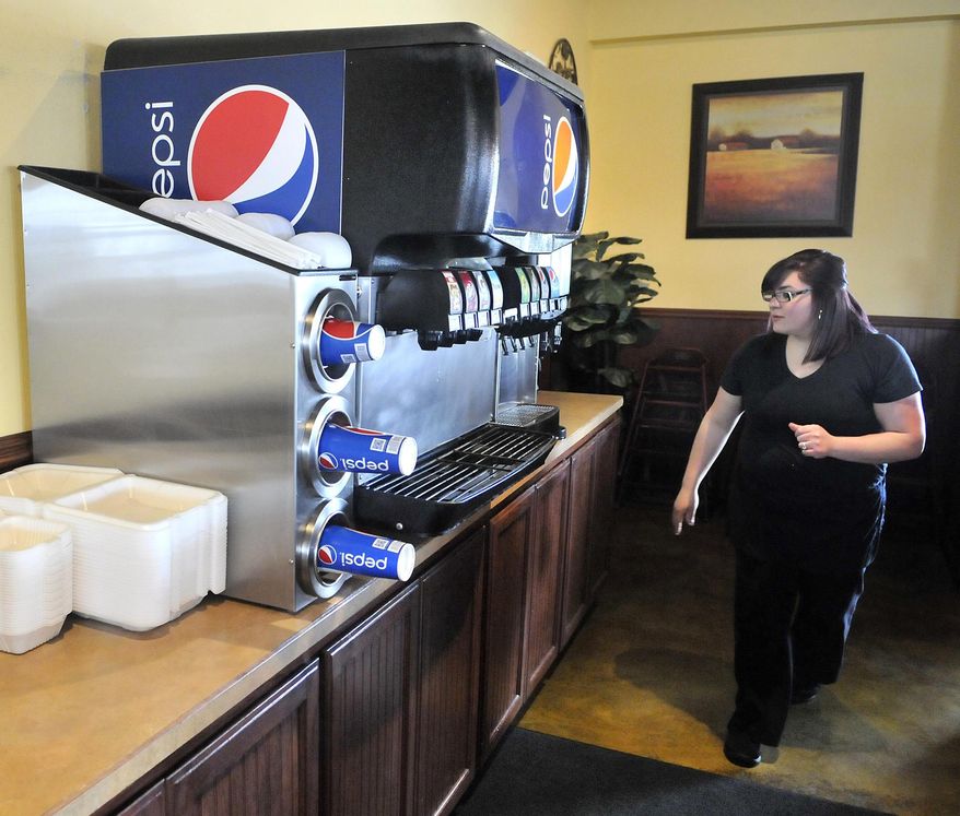 FOR RELEASE SATURDAY, FEBRUARY 4, 2017, AT 12:01 A.M. MST. - Nimsi Santacruz prepares the drink station for the lunch crowd Jan. 18 at Upper Crust Bistro and Grill, one of the businesses in the Burley-Heyburn Industrial Park occupying the former Simplot factory site.  (Laurie Welch/The Times-News via AP)