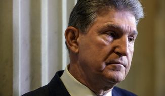 In this Feb. 1, 2017, photo, Sen. Joe Manchin, D-W.Va. pauses during a television news interview on Capitol Hill in Washington. President Donald Trump has struck up an unlikely political bond with Democratic Sen. Joe Manchin. The relationship between the West Virginia coal broker and New York real estate mogul has turned Manchin into one of the Democrats’ best conduits into the new administration. (AP Photo/J. Scott Applewhite)