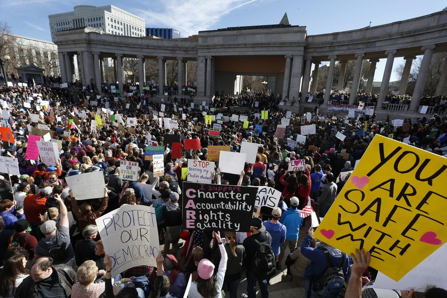 Thousands gather at Denver's City Center Park for a rally in support of the Muslim community and to protest President Donald Trump's executive order to temporarily ban some refugees from seven mostly Muslim countries, in Denver, Saturday, Feb. 4, 2017. (AP Photo/Brennan Linsley)