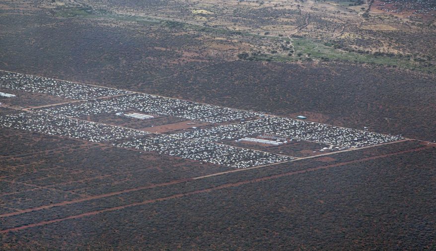 FILE - In this Monday, Feb. 20, 2012 file photo, parts of Dadaab, the world's largest refugee camp, are seen from a helicopter in northern Kenya. About 140 Somali refugees whose resettlement in the United States this week was stopped by President Donald Trump's executive order have been sent back to Dadaab refugee camp in northern Kenya, one of the refugees said Saturday, Feb. 4, 2017. (AP Photo/Ben Curtis, File)