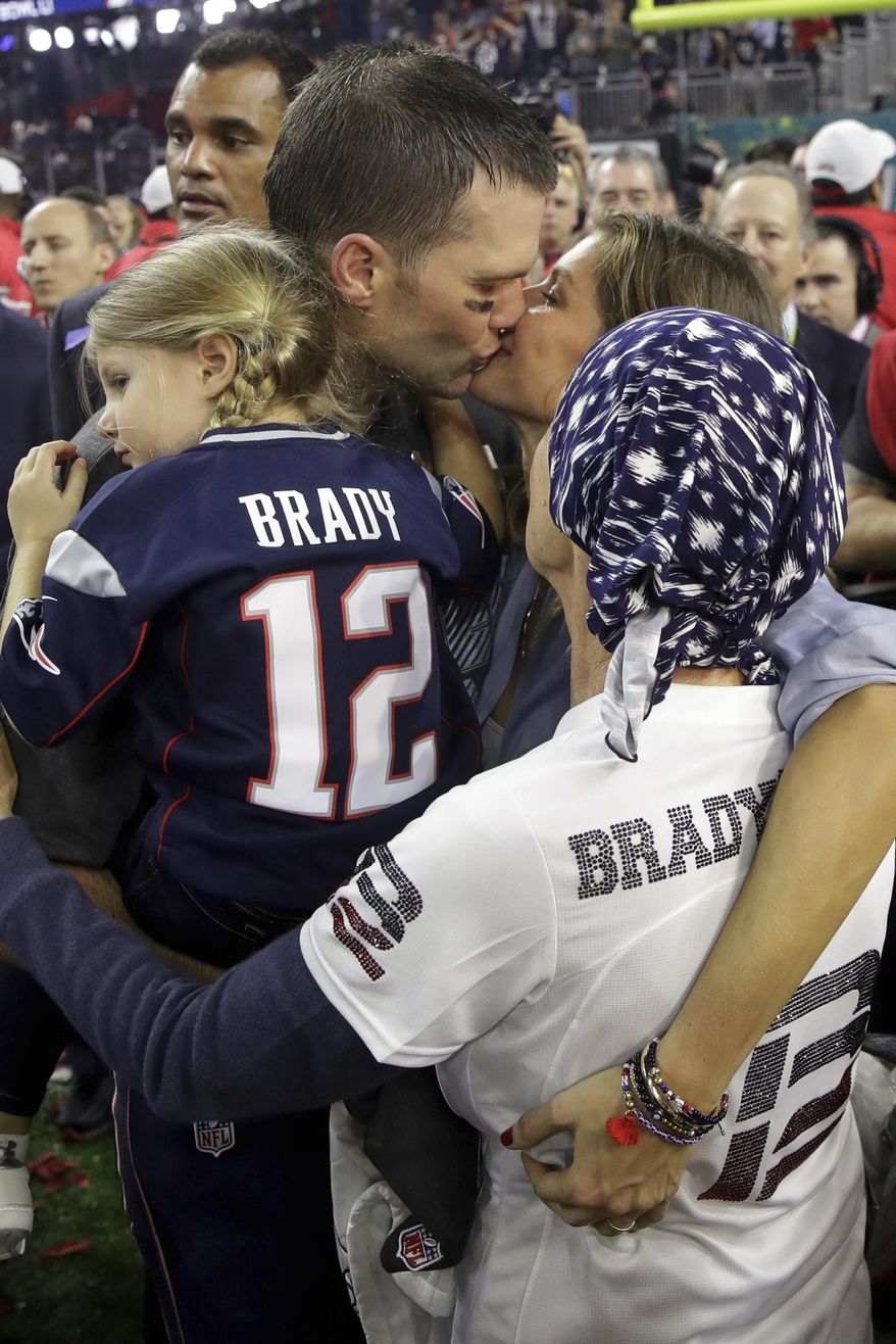 New England Patriots' Tom Brady is surrounded by his family on the field after his team defeated the Atlanta Falcons in overtime at the NFL Super Bowl 51 football game Sunday, Feb. 5, 2017, in Houston. The Patriots defeated the Falcons 34-28. (AP Photo/Patrick Semansky)