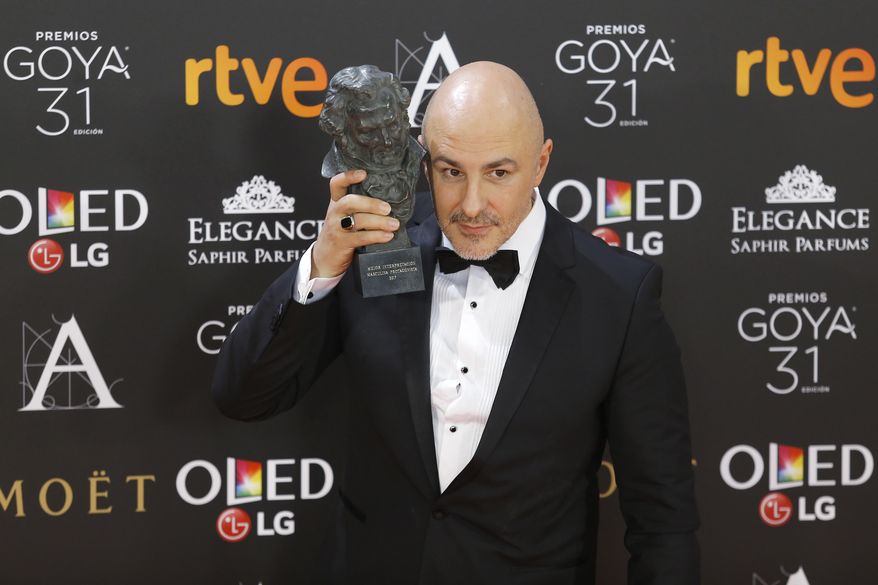 Spanish actor Roberto Alamo poses with his trophy after winning the best actor award for his role in the film "Que Dios nos perdone" during the Goya Film Awards Ceremony in Madrid, Saturday, Feb. 4, 2017. The Goya Awards are Spain's main national annual film awards. (AP Photo/Francisco Seco)