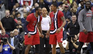 Washington Wizards guard John Wall (2) reacts with guard Bradley Beal, right, after Beal was fouled on a shot during the second half of an NBA basketball game, Tuesday, Jan. 24, 2017, in Washington. The Wizards won 123-108. (AP Photo/Nick Wass) **FILE**