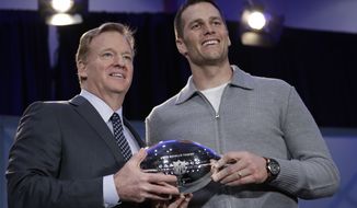 NFL Commissioner Roger Goodell and New England Patriots quarterback Tom Brady pose with the MVP trophy during a news conference after the NFL Super Bowl 51 football game Monday, Feb. 6, 2017, in Houston. Brady was named the MVP of Super Bowl 51. (AP Photo/David J. Phillip)