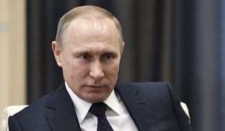 Russian President Vladimir Putin listens during a meeting in Moscow, Russia, Monday, Feb. 6, 2017. The Kremlin is indignant over the comments of a Fox News journalist who called Russian President Vladimir Putin a &quot;killer&quot; in an interview with President Donald Trump. (Alexei Nikolsky, Sputnik, Kremlin Pool Photo via AP)