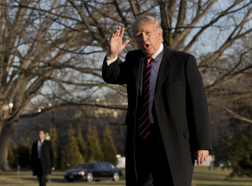 President Donald Trump waves as he walks on the South Lawn upon arrival at the White House in Washington, Monday, Feb. 6, 2017 from a trip to Florida. (AP Photo/Manuel Balce Ceneta)