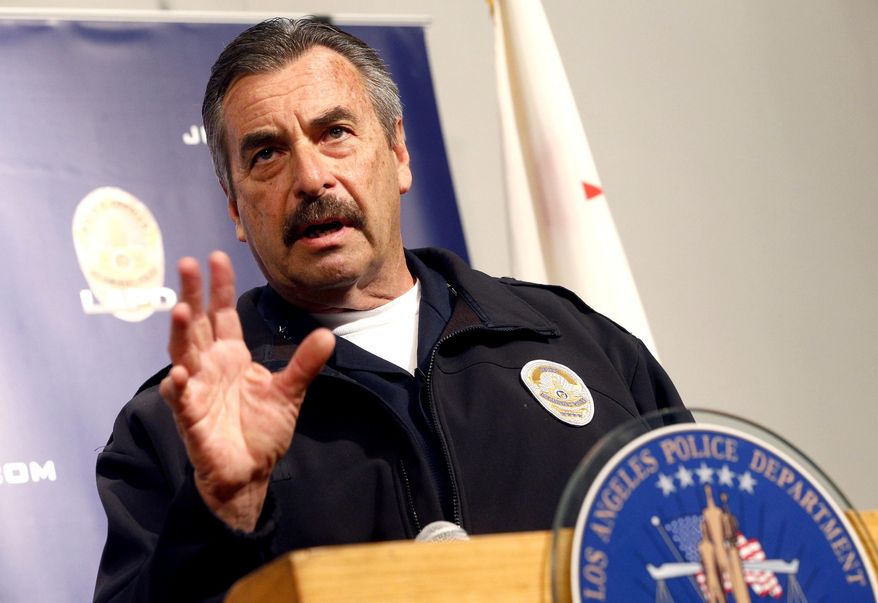 Los Angeles Police Chief Charlie Beck talks during a news conference in Los Angeles, Monday, Feb. 6, 2017. Los Angeles police say three people are in custody and a fourth is being sought in connection with a deadly fire that struck an apartment building in 1993. Beck says two men were arrested Feb. 3 and a woman was already in custody in connection with the fire. Police will ask the district attorney to file homicide charges with special circumstances involving multiple victims, gang affiliations and arson. (AP Photo/Nick Ut)