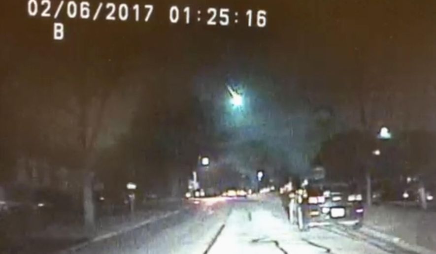 This image from a dashcam video provided by the Lisle Police Department in Lisle, Ill., shows a meteor as it streaked over Lake Michigan early Monday morning, Feb. 6, 2017. The meteor lit up the sky across several states in the Midwest. (Lisle (Ill.) Police Department via AP)