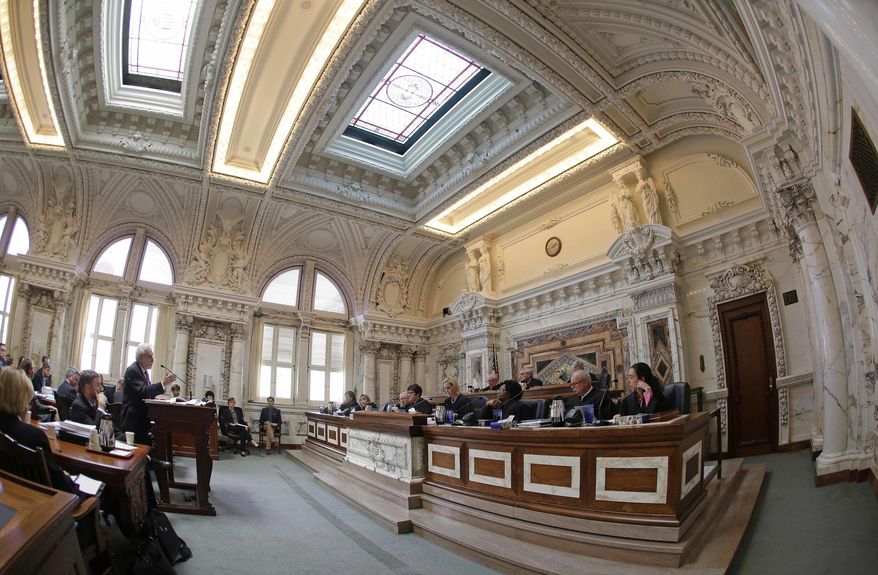 FILE- In this Sept. 18, 2014, file photo, Dennis Riordan, left, attorney for defendant Barry Bonds, argues before an 11-judge panel of the 9th U.S. Circuit Court of Appeals in San Francisco. The federal appellate court is hearing arguments whether to reinstate President Donald Trump's immigration travel ban. (AP Photo/Eric Risberg, Pool, File)