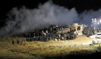 FILE - In this Nov. 20, 2016, file photo, provided by the Morton County Sheriff&#39;s Department, law enforcement and protesters clash near the site of the Dakota Access pipeline in Cannon Ball, N.D. A federal judge said Tuesday, Feb. 7, 2017, pipeline opponents involved in the violent clash with police are unlikely to succeed in a lawsuit alleging excessive force and civil rights violations. (Morton County Sheriff&#39;s Department via AP, File)