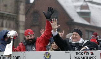 New England Patriots defensive coordinator Matt Patricia holds the Super Bowl trophy, left, as he and coach Bill Belichick wave during a parade Tuesday, Feb. 7, 2017, in Boston to celebrate their 34-28 win over the Atlanta Falcons in Sunday&#39;s NFL Super Bowl 51 football game in Houston. (AP Photo/Steven Senne)