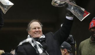 New England Patriots head coach Bill Belichick holds up a Super Bowl trophy as he addresses the crowd during a rally Tuesday, Feb. 7, 2017, in Boston, to celebrate Sunday&#39;s 34-28 win over the Atlanta Falcons in the NFL Super Bowl 51 football game in Houston. (AP Photo/Elise Amendola)