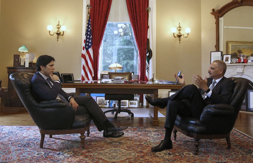 Senate President Kevin de Leon, D-Los Angeles, left, mets with former U.S. Attorney General Eric Holder, Tuesday, Feb. 7, 2017, in Sacramento, Calif. Holder has been hired by Democratic leaders of California&#39;s Legislature to represent them in legal issues against President Donald Trump and his administration. Holder met with de Leon, Assembly Speaker Anthony Rendon, D- Paramount, and Gov. Jerry Brown during his visit. (AP Photo/Rich Pedroncelli)