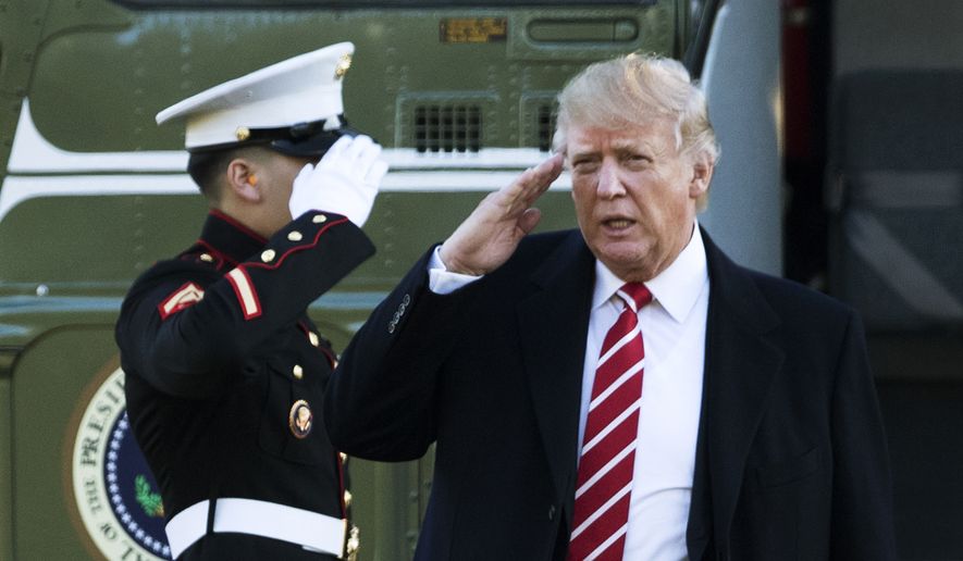 U.S. President Donald Trump salutes a Marines honor guard as he disembarks from Marine One upon arrival at the White House in Washington in this Monday, Feb. 6, 2017, file photo. (AP Photo/Manuel Balce Ceneta, File)