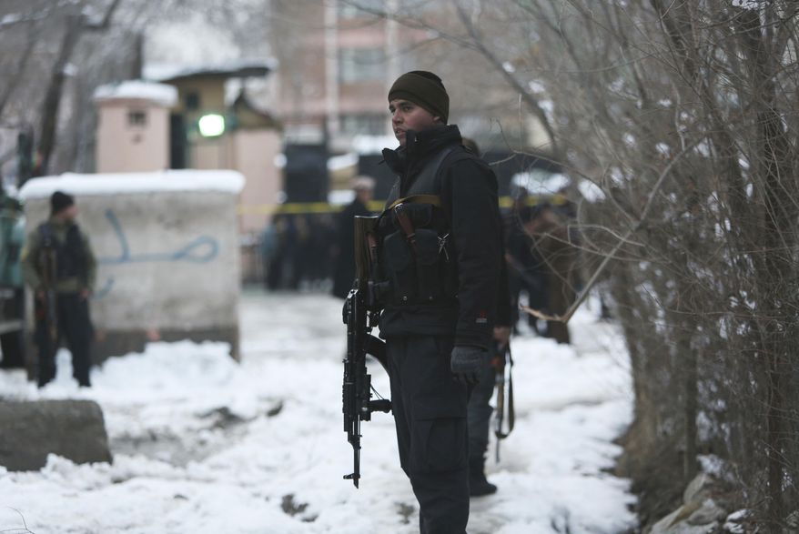 Security personnel stand guard at the site of a suicide attack on the Supreme Court in Kabul, Afghanistan, Tuesday, Feb. 7, 2017. A suicide bomber on Tuesday targeted the Supreme Court building in the Afghan capital, Kabul, killing over a dozen people, officials said. (AP Photo/Rahmat Gul)