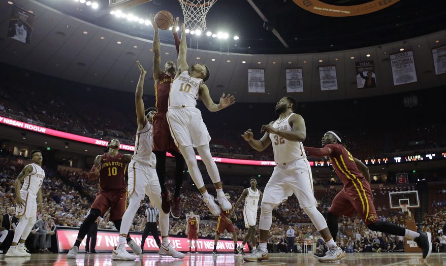 Iowa State guard Nick Weiler-Babb (1) is fouled as he drives to the basket against Texas guard Eric Davis Jr. (10) during the first half of an NCAA college basketball game, Tuesday, Feb. 7, 2017, in Texas, Texas. (AP Photo/Eric Gay)