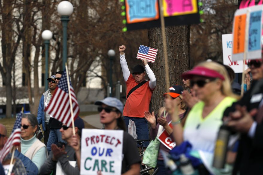 Supporters of the Affordable Care Act who are also opponents of Colorado's GOP-led plan to undo Colorado's state-run insurance exchange gather for a rally organized by the national Save My Care Bus Tour, on the state Capitol steps in Denver, Tuesday, Feb. 7, 2017. A bill being heard in the Senate Finance Committee would abolish the state-run health insurance exchange. (AP Photo/Brennan Linsley)