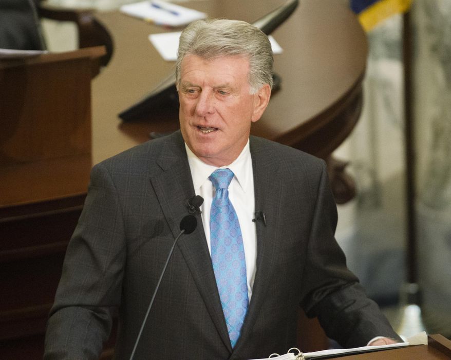 FILE -In this Jan. 9, 2017, file photo, Idaho Gov. C.L. "Butch" Otter delivers his State of the State address inside the house chambers at the state Capitol building, in Boise, Idaho. Otter said he chose the wrong word in his recent remarks acknowledging his preference that Christian refugees should be treated as a priority. Otter, speaking at an Idaho Press Club event Tuesday, Feb. 7, 2017, said he believes in religious preference, not religious discrimination. (AP Photo/Otto Kitsinger, File)
