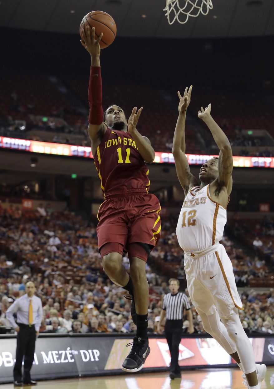 Iowa State guard Monte Morris (11) shoots over Texas guard Kerwin Roach Jr. (12) during the first half of an NCAA college basketball game, Tuesday, Feb. 7, 2017, in Texas, Texas. (AP Photo/Eric Gay)