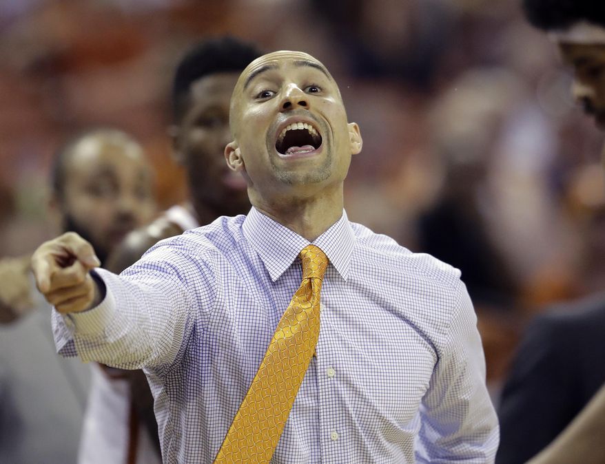 Texas head coach Shaka Smart talks to his players during the first half of an NCAA college basketball game against Iowa State, Tuesday, Feb. 7, 2017, in Texas, Texas. (AP Photo/Eric Gay)