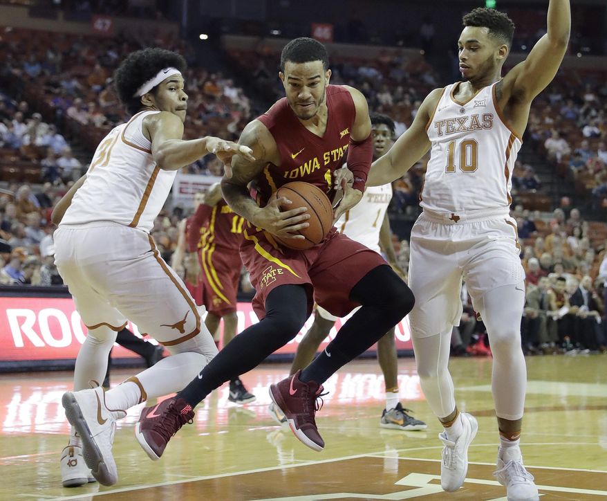 Iowa State guard Nick Weiler-Babb, center, drives between Texas defenders Jarrett Allen (31) and Eric Davis Jr. (10) during the first half of an NCAA college basketball game, Tuesday, Feb. 7, 2017, in Texas, Texas. (AP Photo/Eric Gay)