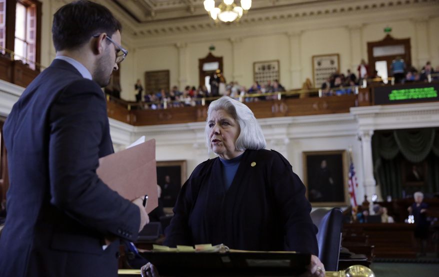 Texas Sen. Judith Zaffirini, D-Laredo, right, talks on the floor before a debate on an anti-sanctuary cities proposal in the Senate Chamber at the Texas Capitol, Tuesday, Feb. 7, 2017, in Austin, Texas. (AP Photo/Eric Gay)