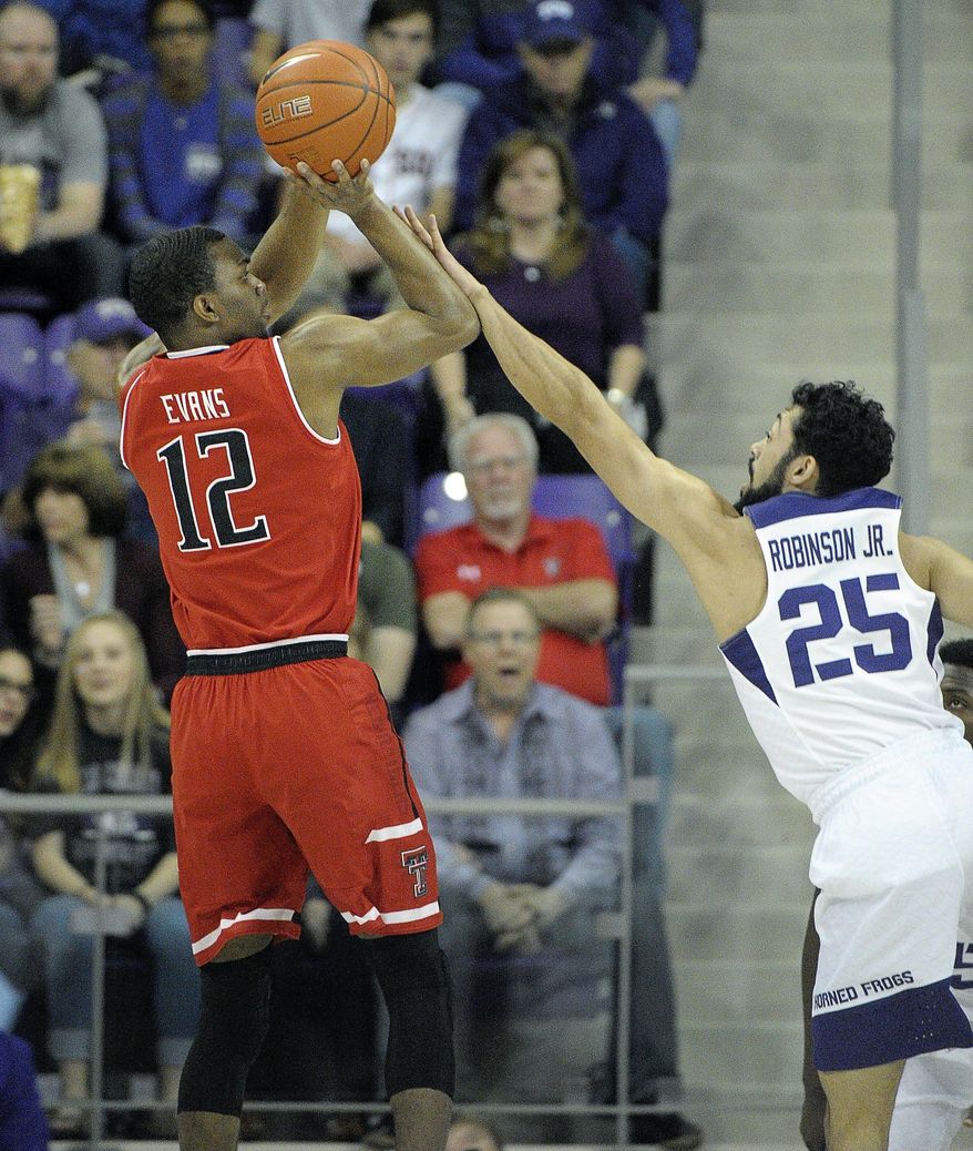 Texas Tech guard Keenan Evans (12) shoots over TCU guard Alex Robinson (25) during the first half of an NCAA college basketball game Tuesday, Feb. 7, 2017, in Fort Worth, Texas. (Max Faulkner/Star-Telegram via AP)
