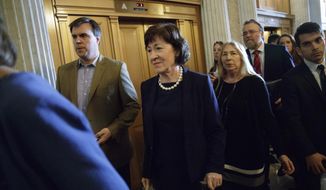 Sen. Susan Collins, R-Maine, center, who defected from the GOP majority, arrives at the Senate chamber on Capitol Hill in Washington, Tuesday, Feb. 7, 2017, as the Senate voted for Education Secretary-designate Betsy DeVos,. ice President Mike Pence was needed to cast the tie-breaking vote to confirm DeVos. (AP Photo/J. Scott Applewhite)