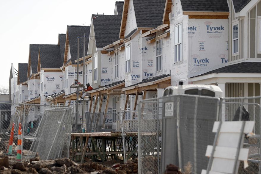 This Monday, Jan. 30, 2017 photo shows new housing under construction in St. Louis. The development is receiving federal low-income housing tax credits. (AP Photo/Jeff Roberson)