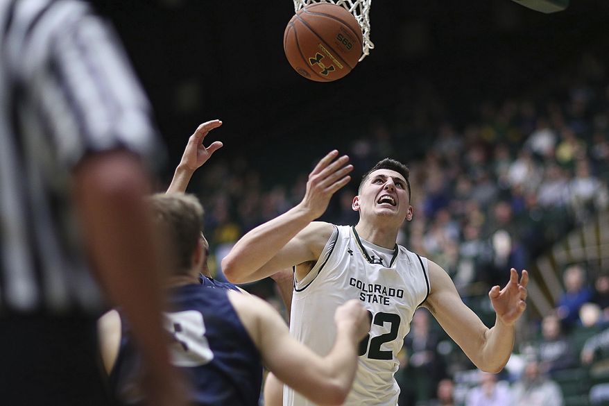Colorado State forward Nico Carvacho looks to grab an offensive rebound against Utah State Tuesday Feb. 7, 2017, at Moby Arena in Fort Collins, Colo. (Brian Smith/Fort Collins Coloradoan via AP)