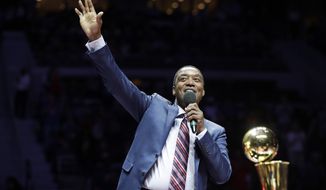 Former Detroit Pistons guard Isiah Thomas waves to the crowd during halftime of an NBA basketball game between the Detroit Pistons and the Los Angeles Lakers, Wednesday, Feb. 8, 2017, in Auburn Hills, Mich. Thomas was honored at halftime as part of the team&#39;s ongoing celebration of its years at The Palace. (AP Photo/Carlos Osorio)