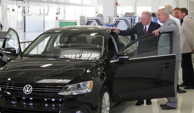 FILE - In this Wednesday, July 21, 2010, file photo, Volkswagen AG Chairman Martin Winterkorn, right, shows a 2011 Jetta to Tennessee Gov. Phil Bredesen during a visit to the German automaker&#39;s unfinished Chattanooga, Tenn., plant, intended for larger vehicles. The Jetta is Volkswagen AG’s biggest seller in the U.S. Volkswagen has been making the Jetta in Puebla, Mexico, since 1993. (AP Photo/Bill Poovey, File)
