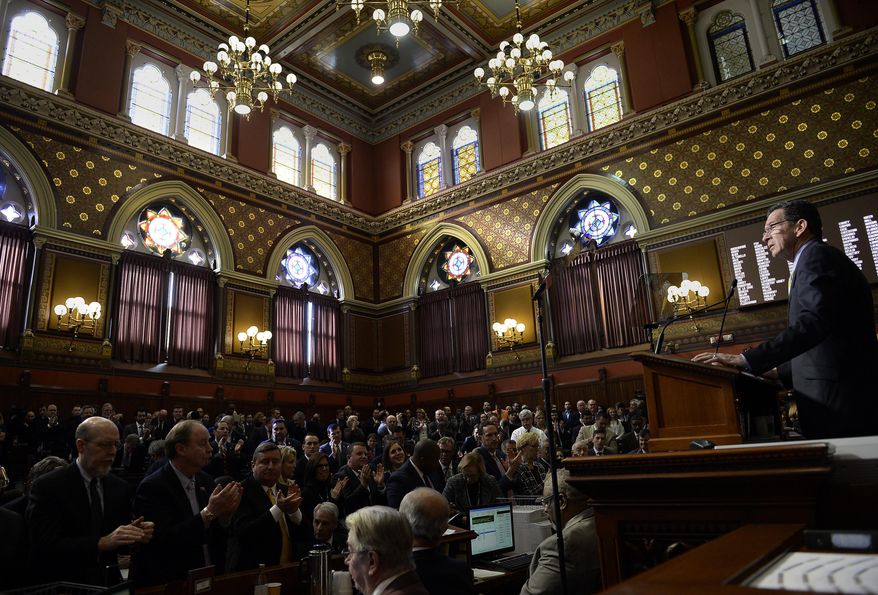 Connecticut Gov. Dannel P. Malloy delivers his budget address to members of the house and senate inside the Hall of the House at the state Capitol in Hartford, Conn., Wednesday, Feb. 8, 2017. (AP Photo/Jessica Hill)