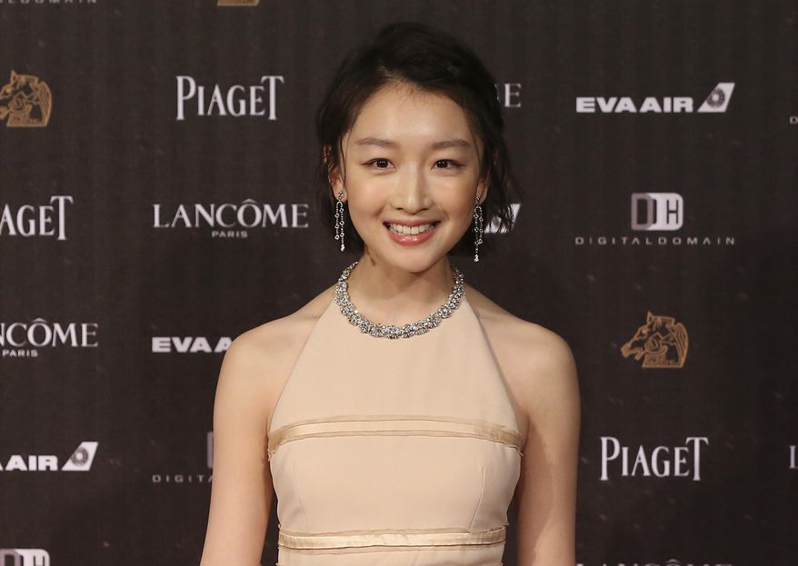 FILE - In this Saturday, Nov. 26, 2016, file photo, Chinese actress Zhou Dongyu arrives at the 53rd Golden Horse Awards in Taipei, Taiwan. Romance drama “Soul Mate” has charmed the Hong Kong Film Awards. The coming-of-age tale of two girls falling for the same boy received 12 nominations, with Zhou and Ma Sichun both getting nods in the best actress category. The awards ceremony is on April 9. (AP Photo/Billy Dai, File)