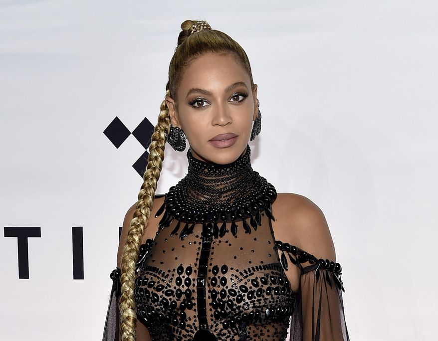 FILE - In this Oct. 15, 2016 file photo, singer Beyonce Knowles attends the Tidal X: 1015 benefit concert in New York.  Beyonce is nominated for Grammy Awards for best album, best song and record of the year. (Photo by Evan Agostini/Invision/AP, File)