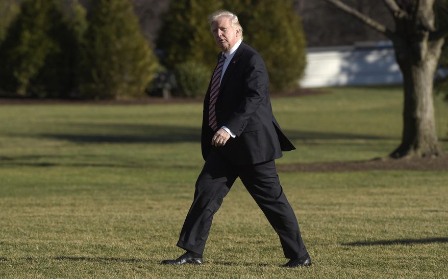 FILE - In this Thursday, Jan. 26, 2017, file photo, President Donald Trump walks on the South Lawn of the White House in Washington after returning from a trip to Philadelphia. Lawmakers in Massachusetts and other Democratic-leaning states are considering ways to flex their muscles in response to the policies of President Donald Trump. House Democrats have scheduled an unusual caucus for Wednesday, Feb. 8, 2017, at the Statehouse to discuss a response to "recent actions" by the Trump administration. (AP Photo/Susan Walsh, File)