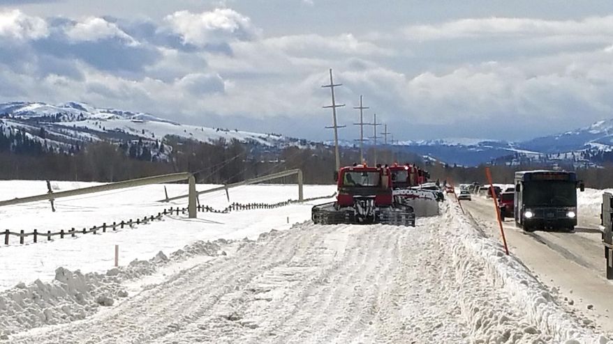 Downed power lines and polls are shown along the Moose-Wilson Road near Teton Village, Wyo. Wednesday, Feb.8, 2017, after an overnight storm blew through the area. Wind gusts of up to 90 mph were reported in west-central Wyoming Tuesday night, but a Lower Valley Energy source said it's not clear if it was straight winds, microbursts or something else that bent some of the steel poles over like they were made of balsa wood. (Brian Tanabe/Lower Valley Energy via AP)