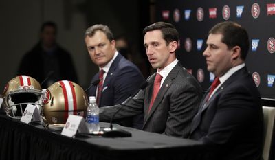 San Francisco 49ers head coach Kyle Shanahan, center, answers questions next to general manager John Lynch, left, and owner Jed York during an NFL football press conference Thursday, Feb. 9, 2017, in Santa Clara, Calif. (AP Photo/Marcio Jose Sanchez)
