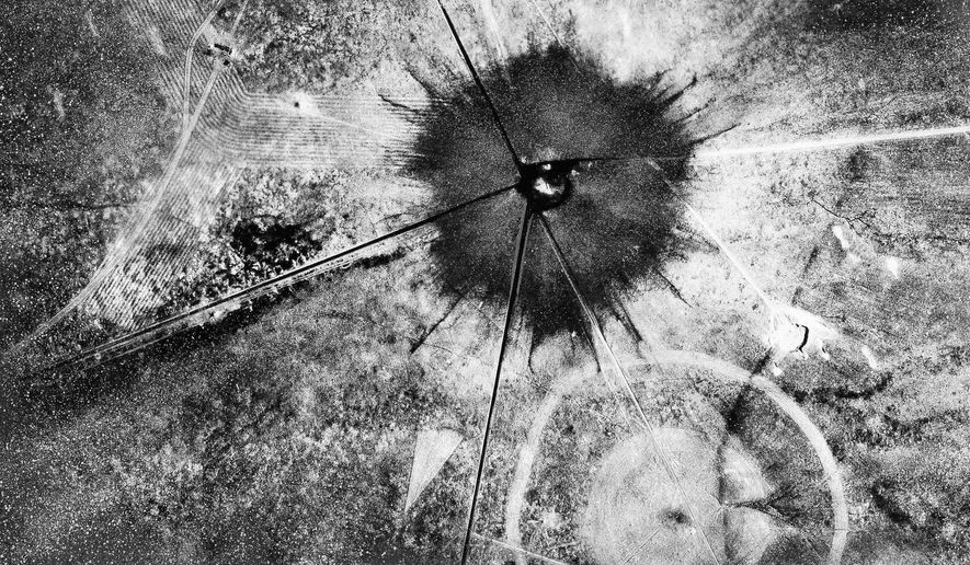 FILE - This July 16, 1945 file photo shows an aerial view after the first atomic explosion at Trinity Test Site, N.M. A report is scheduled to be released Friday, Feb. 10, 2017, on the health effects of the people who lived near the site of the world's first atomic bomb test. The Tularosa Basin Downwinders Consortium will release the health assessment report, on residents of a historic Hispanic village of Tularosa near the Trinity Test in the New Mexico desert. (AP Photo, File)
