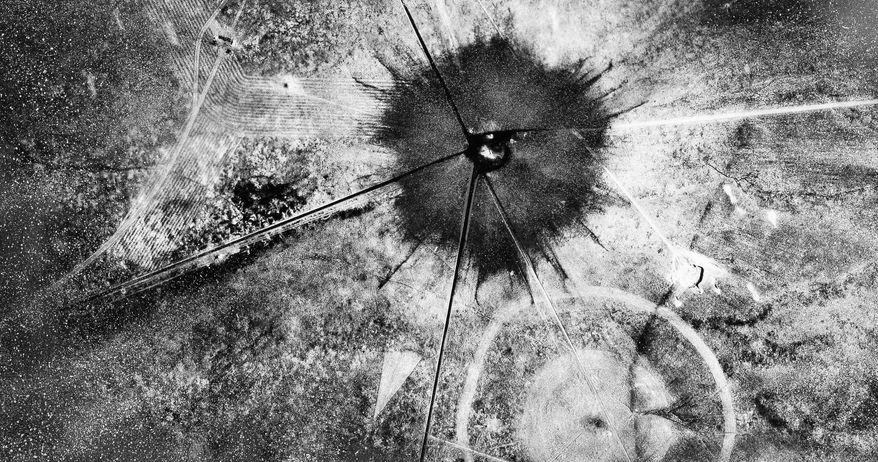 FILE - This July 16, 1945 file photo shows an aerial view after the first atomic explosion at Trinity Test Site, N.M. A report is scheduled to be released Friday, Feb. 10, 2017, on the health effects of the people who lived near the site of the world's first atomic bomb test. The Tularosa Basin Downwinders Consortium will release the health assessment report, on residents of a historic Hispanic village of Tularosa near the Trinity Test in the New Mexico desert. (AP Photo, File)