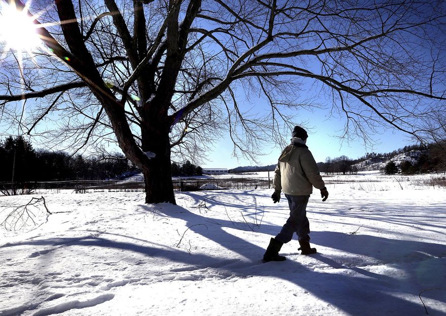In this Feb. 3 2017 photo, Ron Baerbock walks his 10-acre homestead in rural Merrillan, Wis. His property is adjacent to land where proposed frack sand mines and processing facilities might be built. According to complaints filed in Jackson County Circuit Court, two proposed mines with processing and loading facilities would infringe on the rights of six families who live on or own neighboring properties. (Peter Thomson/La Crosse Tribune/La Crosse Tribune via AP)