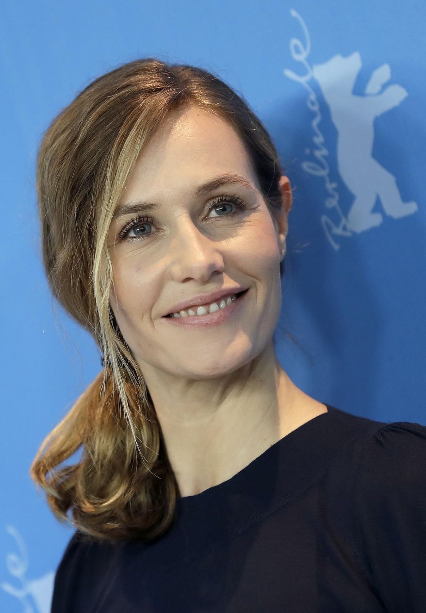 Actress Cecile de France poses for the photographers during a photo call for the film 'Django' at the 2017 Berlinale Film Festival in Berlin, Germany, Thursday, Feb. 9, 2017. (AP Photo/Michael Sohn)