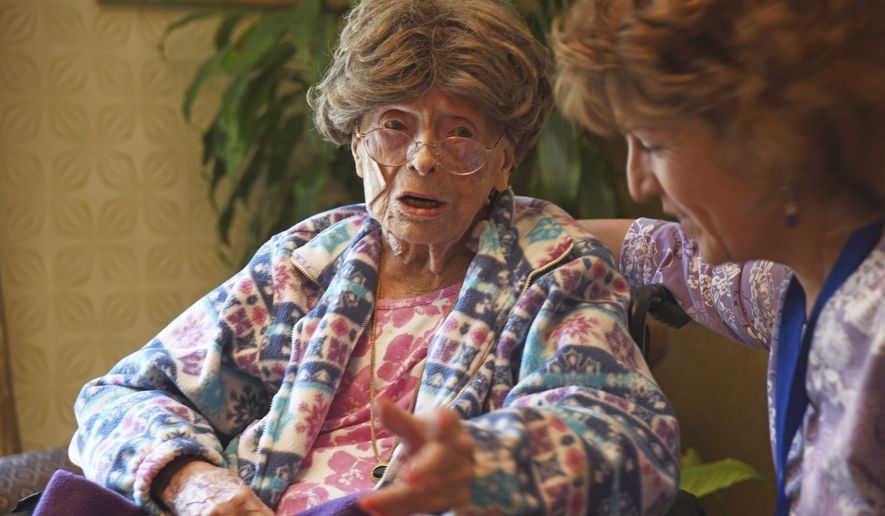 FILE – In this July 19, 2016, file photo, 113-year-old Adele Dunlap, left, talks with Susan Dempster, right, the activities director at the Country Arch Care Center in Pittstown, N.J. Dunlap, a 114-year-old New Jersey woman who was believed to be the oldest person in the U.S., died Sunday, Feb. 5, 2017, at a medical center near Flemington, N.J. Dunlap was born Dec. 12, 1902, in Newark, N.J. (Chris Pedota/The Record via AP, File)