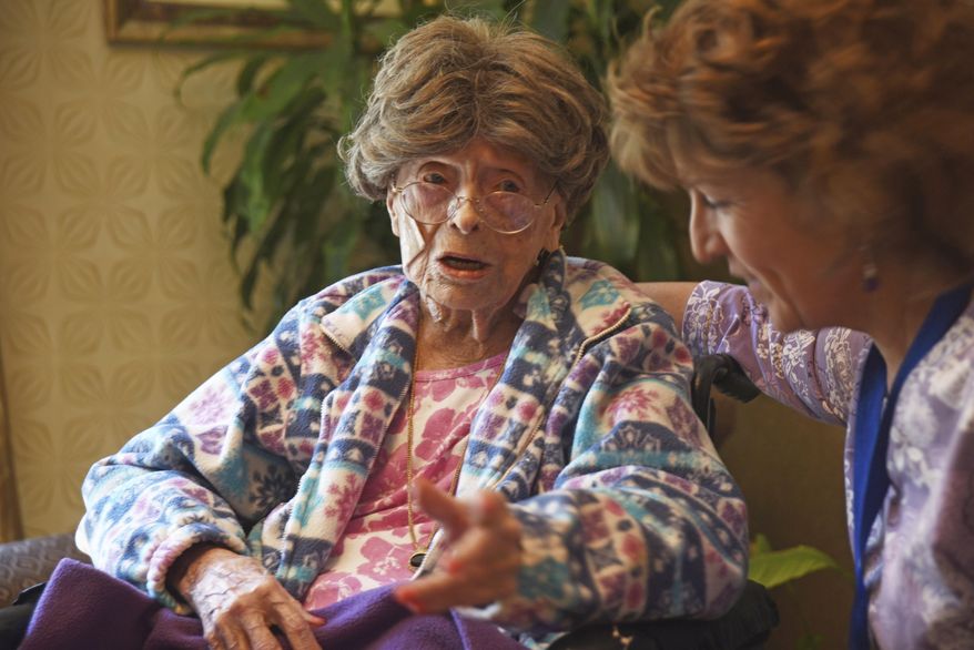 FILE – In this July 19, 2016, file photo, 113-year-old Adele Dunlap, left, talks with Susan Dempster, right, the activities director at the Country Arch Care Center in Pittstown, N.J. Dunlap, a 114-year-old New Jersey woman who was believed to be the oldest person in the U.S., died Sunday, Feb. 5, 2017, at a medical center near Flemington, N.J. Dunlap was born Dec. 12, 1902, in Newark, N.J. (Chris Pedota/The Record via AP, File)