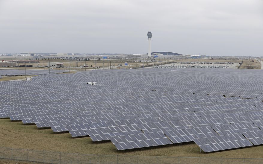 The solar farm at the Indianapolis International Airport is pictured, Wednesday, Feb. 8, 2017, in Indianapolis. Duke Energy and other utilities are backing measures in the Indiana Legislature and several other states that would eventually end the ability of small operators to produce solar power. (AP Photo/Darron Cummings)