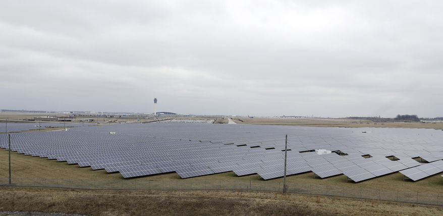The solar farm at the Indianapolis International Airport is pictured, Wednesday, Feb. 8, 2017, in Indianapolis. Duke Energy and other utilities are backing measures in the Indiana Legislature and several other states that would eventually end the ability of small operators to produce solar power. (AP Photo/Darron Cummings)