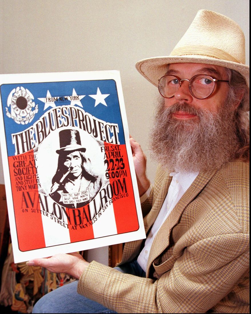 FILE - In this Tuesday, May 20, 1997, file photo, Chet Helms, a concert promoter often called the father of the "Summer of Love" displays a vintage concert poster from the 1960's Summer of Love, in San Francisco. The rights to Summer of Love have been snapped up by the rock promoters Bill Graham Presents. Helms was one of many people who felt the phrase "Summer of Love" should not be allowed to be copyrighted. Helms died in 2005. City officials have rejected a permit for a planned free concert intended to mark the 50th anniversary of the famed Summer of Love in Golden Gate Park that had been planned for June 2017. (AP Photo/Ben Margot, File)