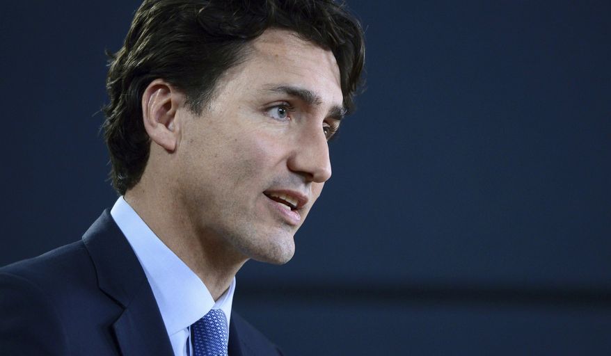 FILE - In this Nov. 29, 2016 file photo, Canada's Prime Minister Justin Trudeau holds a press conference at the National Press Theatre in Ottawa, Ontario. On Monday, Feb. 13, 2017, President Donald Trump will welcome Trudeau to the White House. (Sean Kilpatrick/The Canadian Press via AP, File)