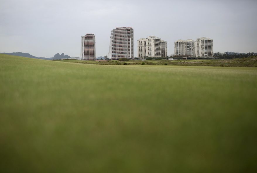 FILE - This Dec. 14, 2016 file photo shows luxury apartments known as "Riserva Golf," off the Olympic golf course in Rio de Janeiro, Brazil, which won't be completed until 2018. In a deal with the city, billionaire developer Pasquale Mauro spent about $20 million to build the course in exchange for permission to construct the multi-million-dollar apartments on some of Rio's most desirable real estate. (AP Photo/Silvia Izquierdo, File)